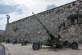 Children inspect military artillery on Gellert Hill in Budapest in Hungary.