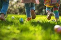 Children on a Joyful Easter Egg Hunt in Sunlit Garden. Kids legs in a park, with colorful eggs dotting the grass on a sunny day. Royalty Free Stock Photo