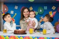 Children joyfully blow in the bells at a birthday party