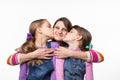 Children joyfully kiss mom, isolated on white background Royalty Free Stock Photo