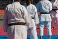 Children with Judo White Uniform doing Public Demonstration Outdoor on Tatami Royalty Free Stock Photo