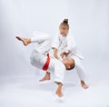 Children in judogi are training throws Royalty Free Stock Photo