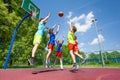 Children jump for flying ball during basketball Royalty Free Stock Photo