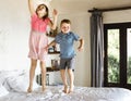 Children jumping on the bed Royalty Free Stock Photo