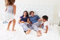 Children Jumping On Parents Bed Wearing Pajamas Royalty Free Stock Photo
