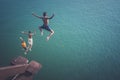 Children jumping into the river