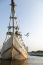 Children jumping into the water from the wooden boats in Jakarta harbor