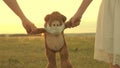 Children keep their beloved teddy bear in a protective mask during quarantine. girls carry in their hand toy teddy bear