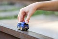 Children kid playing blue color car toy. Child hand playing with car