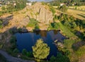 Children, climbing on a polygonal structures of basalt columns, natural monument Panska skala near Kamenicky Senov, Czech Republic