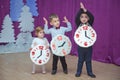 The children . Kindergarten participants take part in a New Year`s event. Cute boys dressed in festive costumes of suit . cheerfu