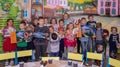 Children from large families with gifts from benefactors at a festive event organized by the charity organization.