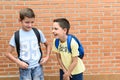 Children laughing. Students carrying a backpack. Concept of Back to school