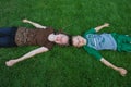 Children laying on grass Royalty Free Stock Photo