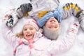 Children Laying On Ground Making Snow Angel Royalty Free Stock Photo