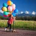 Children learn to ride scooter in a park on sunny summer day. Preschooler boy and girl in safety helmet riding a roller Royalty Free Stock Photo