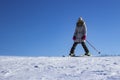 Children learn to snowboard on the mountainside on a clear day Royalty Free Stock Photo