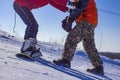 Children learn to snowboard on the mountainside on a clear day Royalty Free Stock Photo