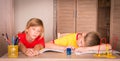 Children with learning difficulties. Tired boy and bored girl do Royalty Free Stock Photo