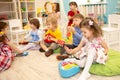 Children learning musical instruments on lesson in kindergarten Royalty Free Stock Photo