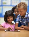 Children, learning and tablet in classroom for online education, scroll on school website and information in group