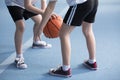 Children learning to dribble basketball