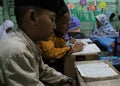 Children are learning to read al quran in the TPA