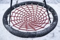 Children left the playground round red swings