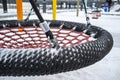 Children left the playground round red swings