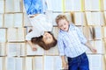 Children lie on a lot of books. Kids are sleeping. View from above. The concept is back to school, education, reading, friendship Royalty Free Stock Photo