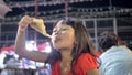 Children Little Girl Enjoys Eating At Street Food.