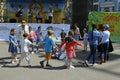 Children little girls boys playing game hands up, musicians playing music on a background. Ethno Fest. Kyiv, Ukraine Royalty Free Stock Photo