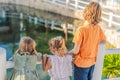 Children looking at fish in a pond Royalty Free Stock Photo