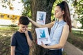 Children are looking for a missing dog, putting up posters Royalty Free Stock Photo