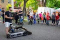 Children looking on performance with a puppets by a street artist