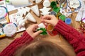 Children make crafts and toys, christmas tree and other. Painting watercolors. Top view. Artwork workplace with creative accessori Royalty Free Stock Photo