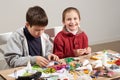 Children make crafts and toys, handmade concept. Artwork workplace with creative accessories. Royalty Free Stock Photo