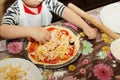 Children make homemade pizza