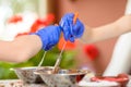 Children make simple figures from chocolate at a master class