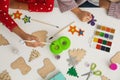 Children making Christmas crafts at table Royalty Free Stock Photo
