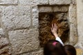 Children making wish & touching holy stone with hope