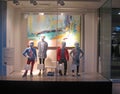 Children mannequins in a shop window display. Royalty Free Stock Photo