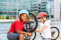 Children mechanics repairing bicycle outdoors Royalty Free Stock Photo