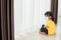 Children in medical mask stay isolation at home for self quarantine. Concept home quarantine, prevention COVID-19, Coronavirus