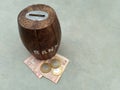 Children money bank with indian note currency and coins