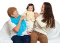 Children with mother and grandmother. Family portrait on white background, happy people sit on sofa.