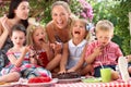 Children And Mothers Eating Cake At Outd Royalty Free Stock Photo