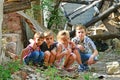 Children are near the ruined house, the concept of natural disaster, fire, and devastation. Royalty Free Stock Photo