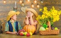 Children near vegetables wooden background. School festival holiday. Elementary school fall festival idea. Kids girl boy