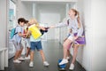 Children offending and bullying boy near lockers